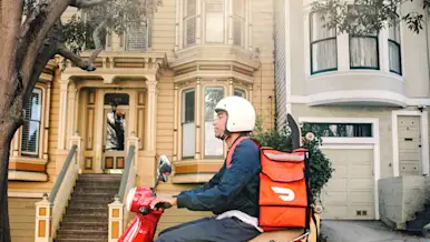 dasher on scooter with red hot bag