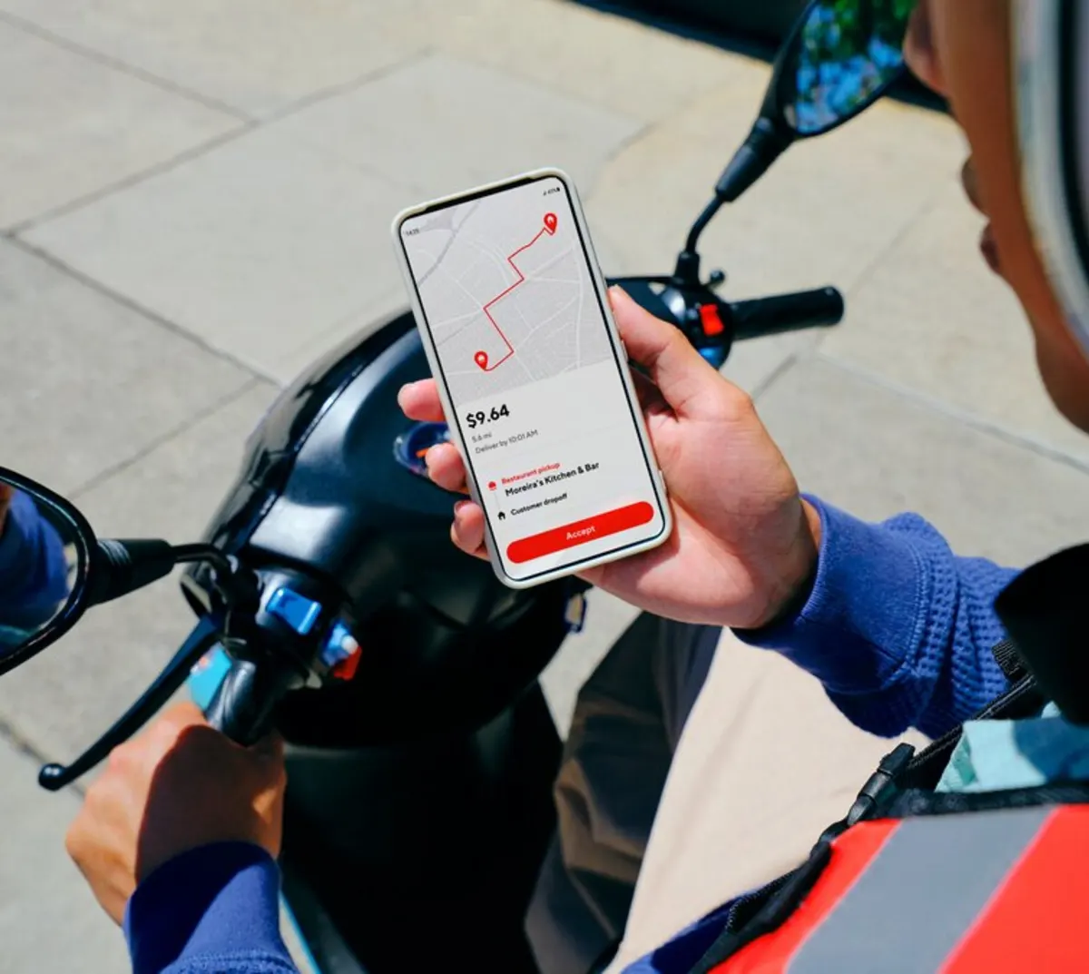 Dx - Dasher on motorcycle using phone to accept an order
