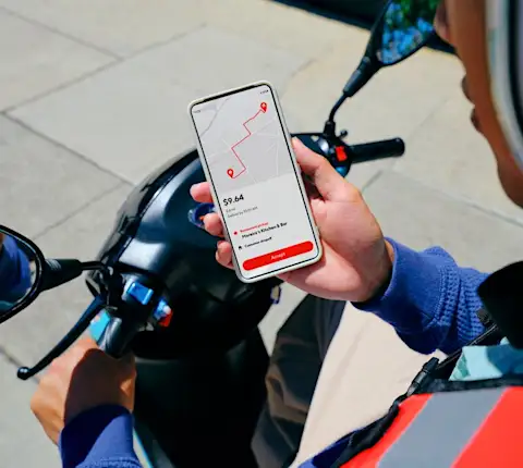 Dx - Dasher on motorcycle using phone to accept an order