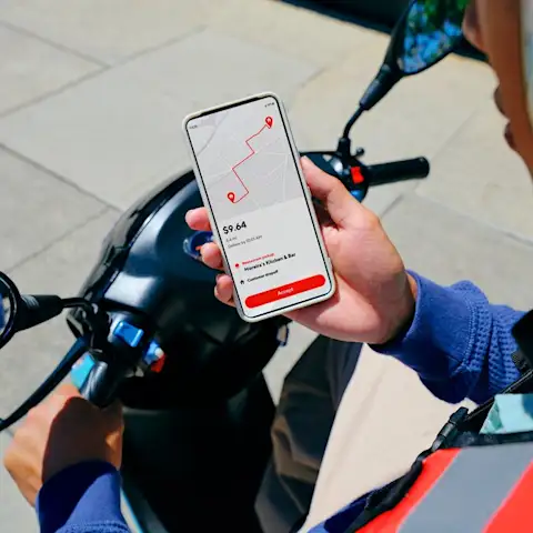 Dx - Dasher on motorcycle using phone to accept an order
