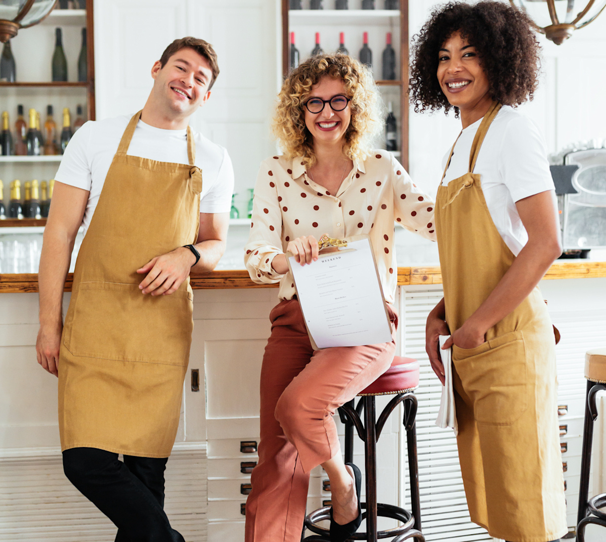 A team of employees in a restaurant/wine bar