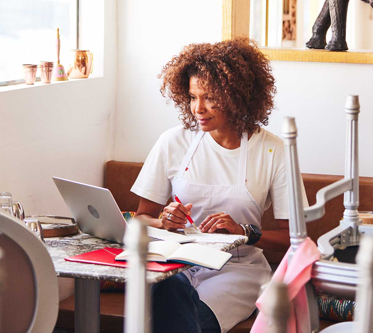 Woman sitting in front of laptop