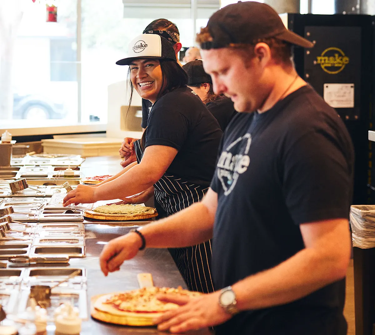 Make Pizza smiling back of house
