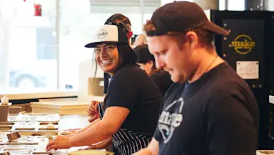 Make Pizza smiling back of house