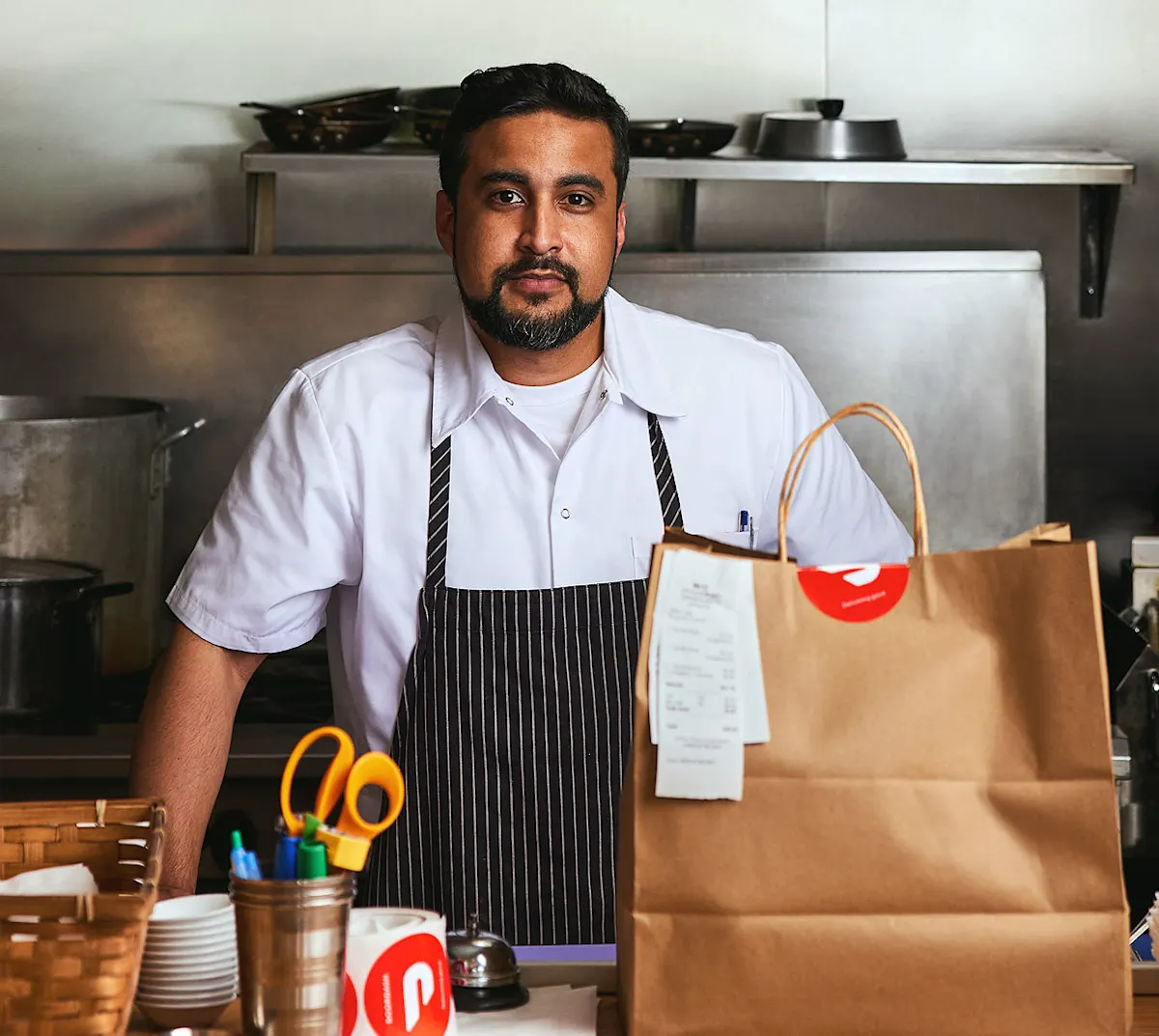 Local restaurant owner in kitchen.