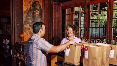A man picking up a bulk meal order