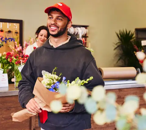 Dx Blog - 2024 Gig Work Trends: Opportunities Gig Workers Can Look Forward To - Dasher with bouquet
