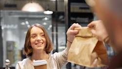 DDfB- Blog - 2024's Top Workplace Trends and How DoorDash for Business Is Powering Productivity - Smiling employee getting coffee and snack