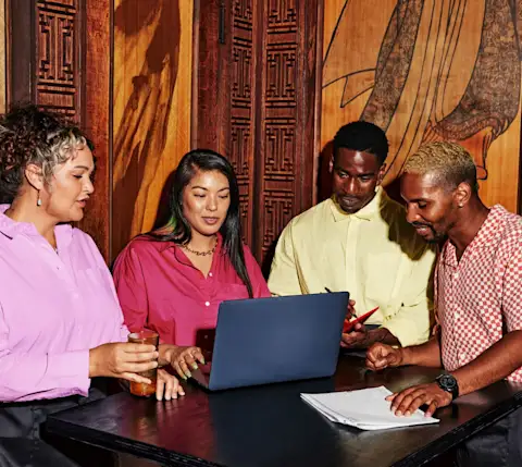 People gathered around computer