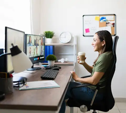 DDfB - Blog - Make New Employees Feel Welcome with a Rewarding Onboarding Experience - remote employee in chair in front of computer during meeting