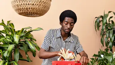 Employee puts plant in DoorDash bag