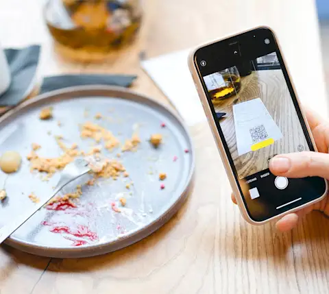 DDfB - Blog - How KIPP NorCal Schools Solved the Challenge of Business Meal Expenses - taking picture of empty plate with phone