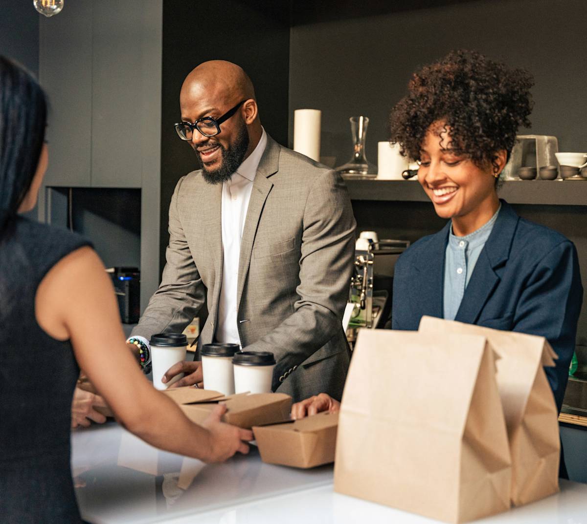 DDfB - Blog - Make New Employees Feel Welcome with a Rewarding Onboarding Experience - new employees with food