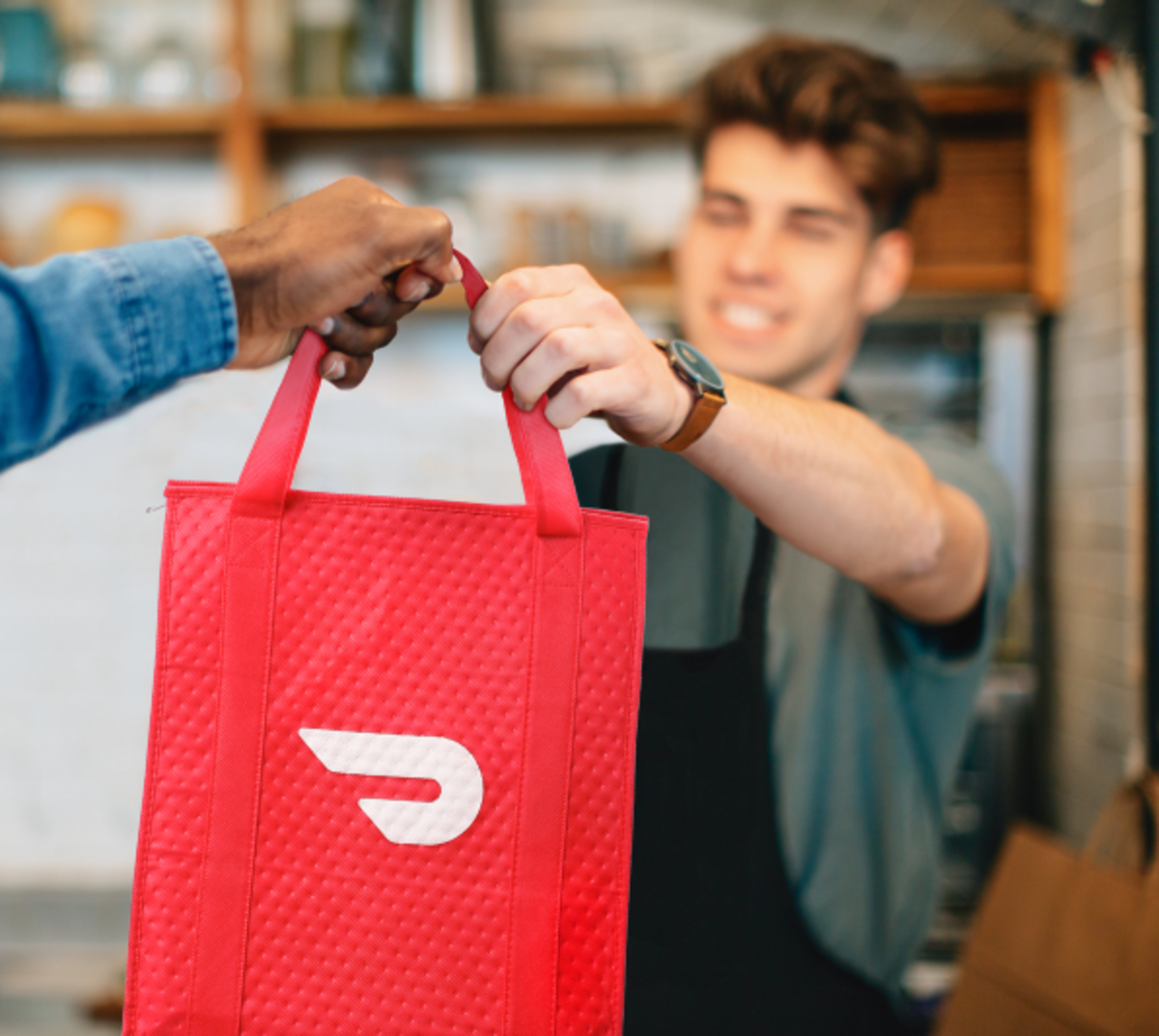 Person handing bag to customer