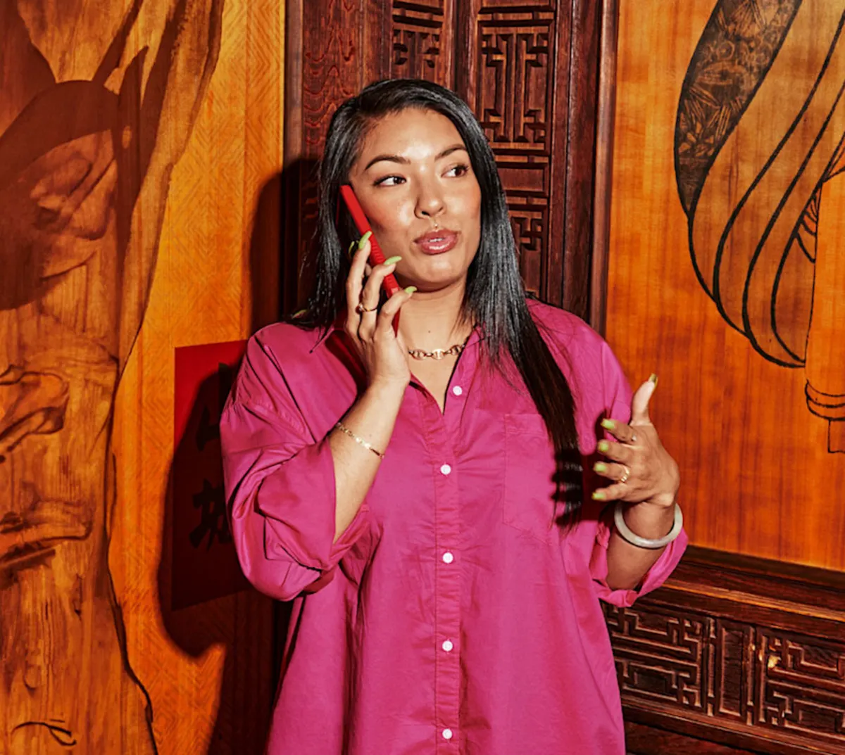 person holding phone at DoorDash pickup area