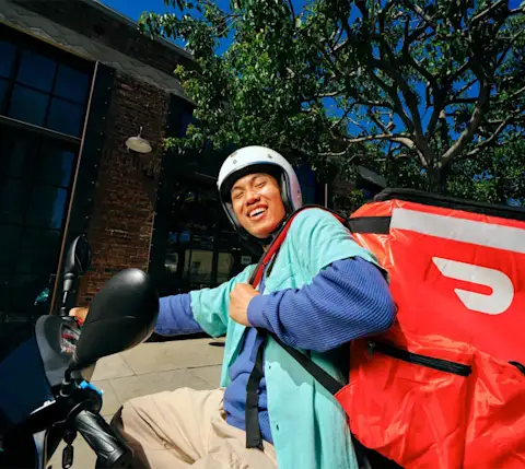 Dasher on scooter with bag