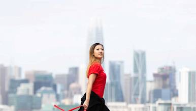 Dasher walking in front of a city skyline