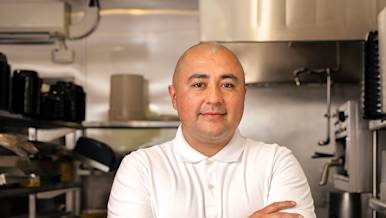 Owner of Senor G's standing in restaurant