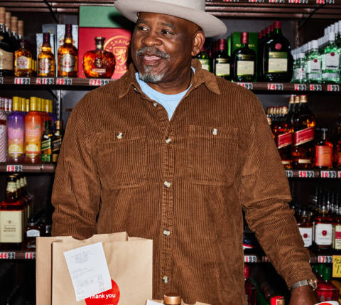 Alcohol merchant standing at the counter 