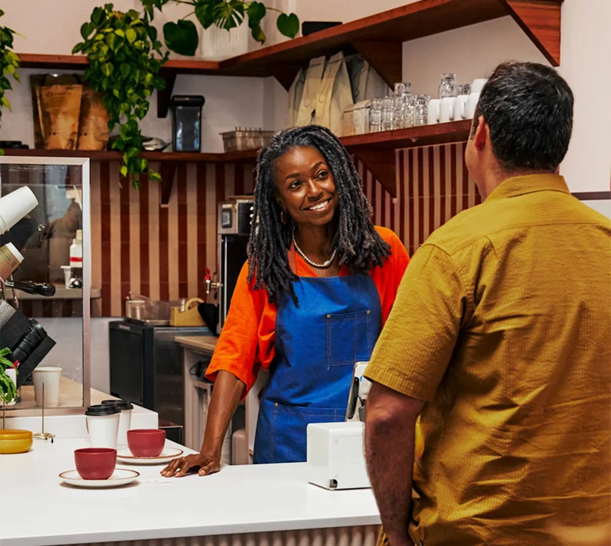 Mx Blog - Host Job Description - Hero Image - Barista counter service at coffee shop