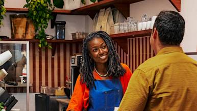 Mx Blog - Host Job Description - Hero Image - Barista counter service at coffee shop
