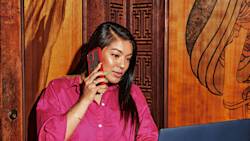 Person on phone with laptop