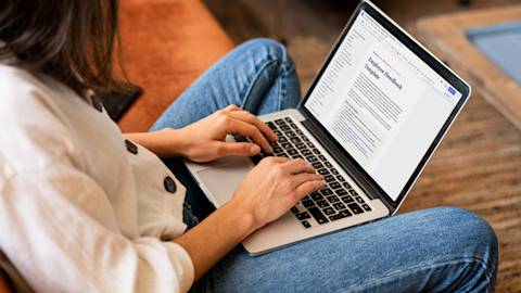 employee handbook template on laptop