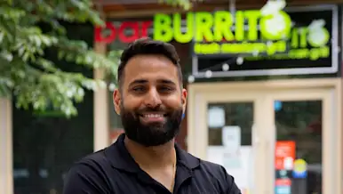 Sunny Singh, owner of BarBurrito in front of his franchise location in the Canary District in Toronto.