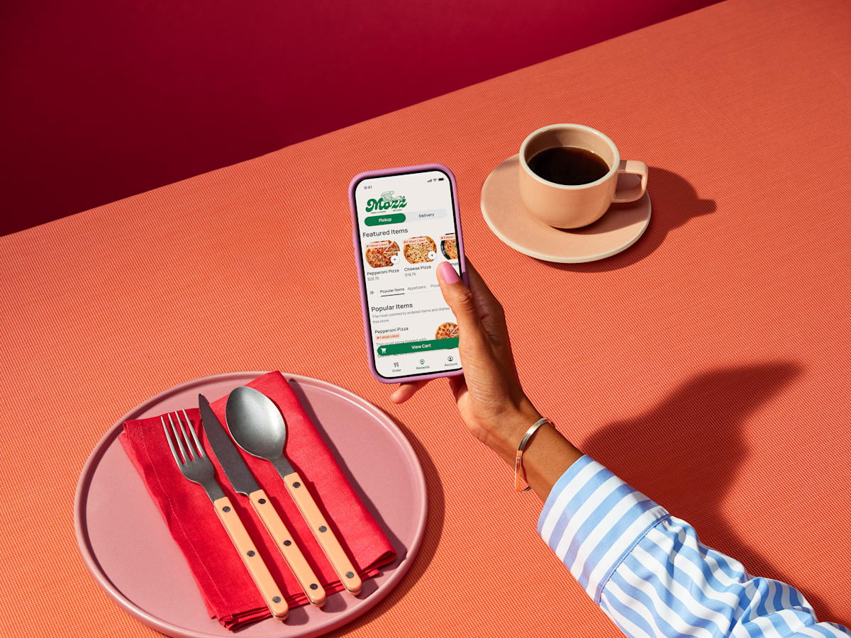 Mx - App for Restaurant - Phone in hand