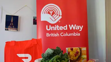 Food Hamper With DoorDash Bag and United Way BC Banner