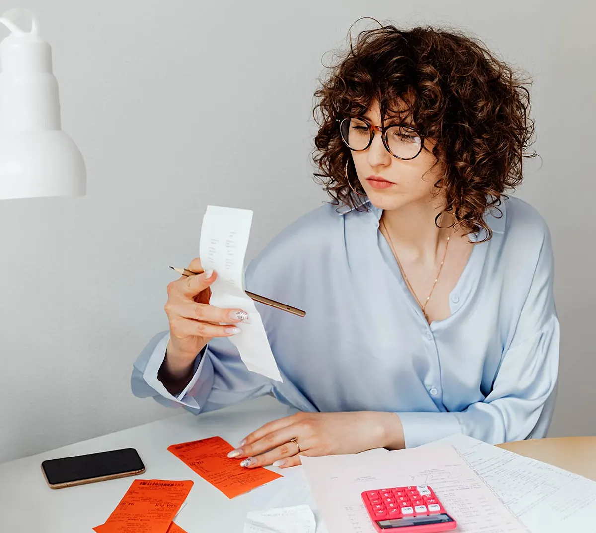 Mx Blog (US/CA/AU/NZ) - How to Calculate Your Food Cost Percentage - owner looking at bills