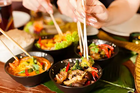 Different plates of Chinese food