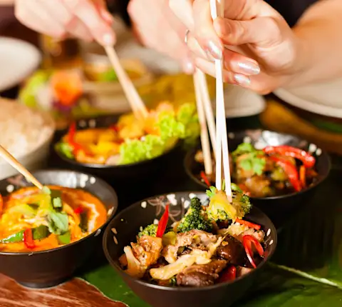 Different plates of Chinese food