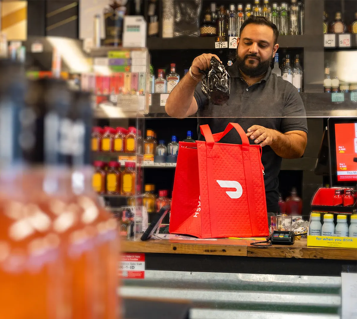 Mx Blog - The Most Popular Alcohol Trends 2024 - Worker at liquor store