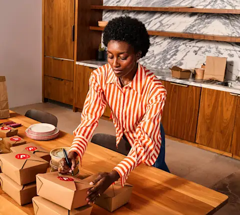 A woman setting the catering for an offsite