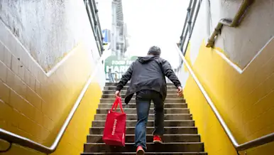 dasher walking up stairs with food