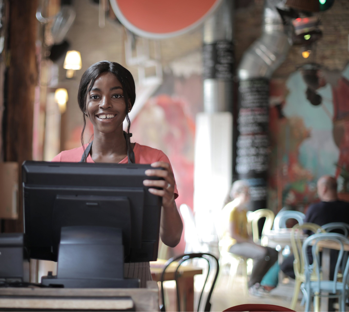 Restaurant worker at computer