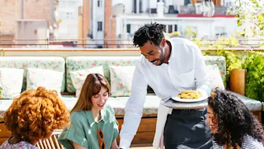 Blog Hero - waiter working at outdoor patio