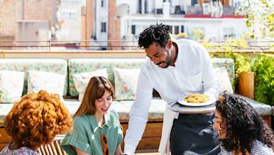 Blog Hero - waiter working at outdoor patio