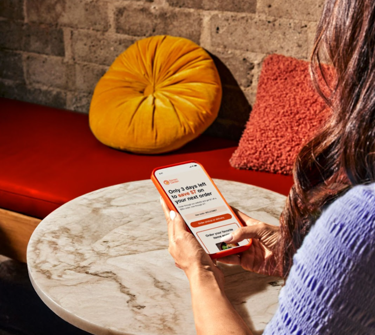 Woman looking at CRM email on phone