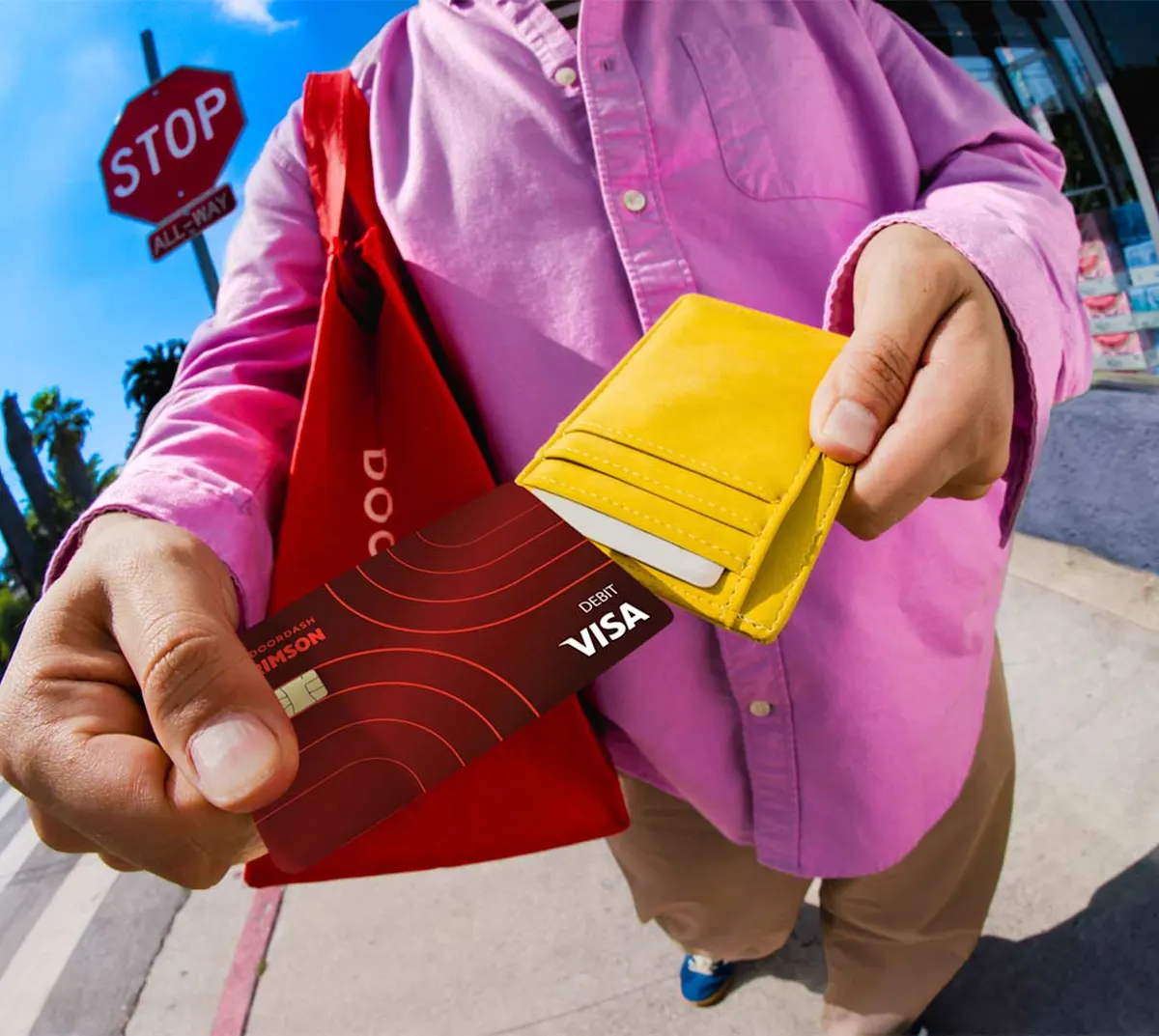 Dasher pulling Crimson card out of wallet