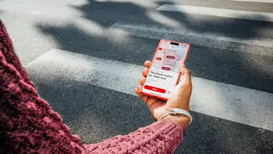 Dasher pulling Crimson card out of wallet