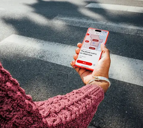 Dasher pulling Crimson card out of wallet