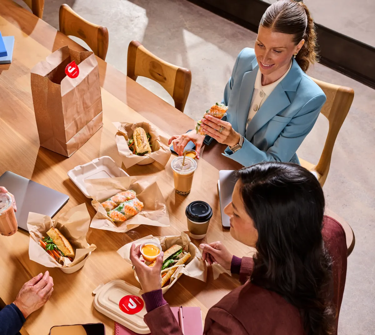 A group of people eating at their office