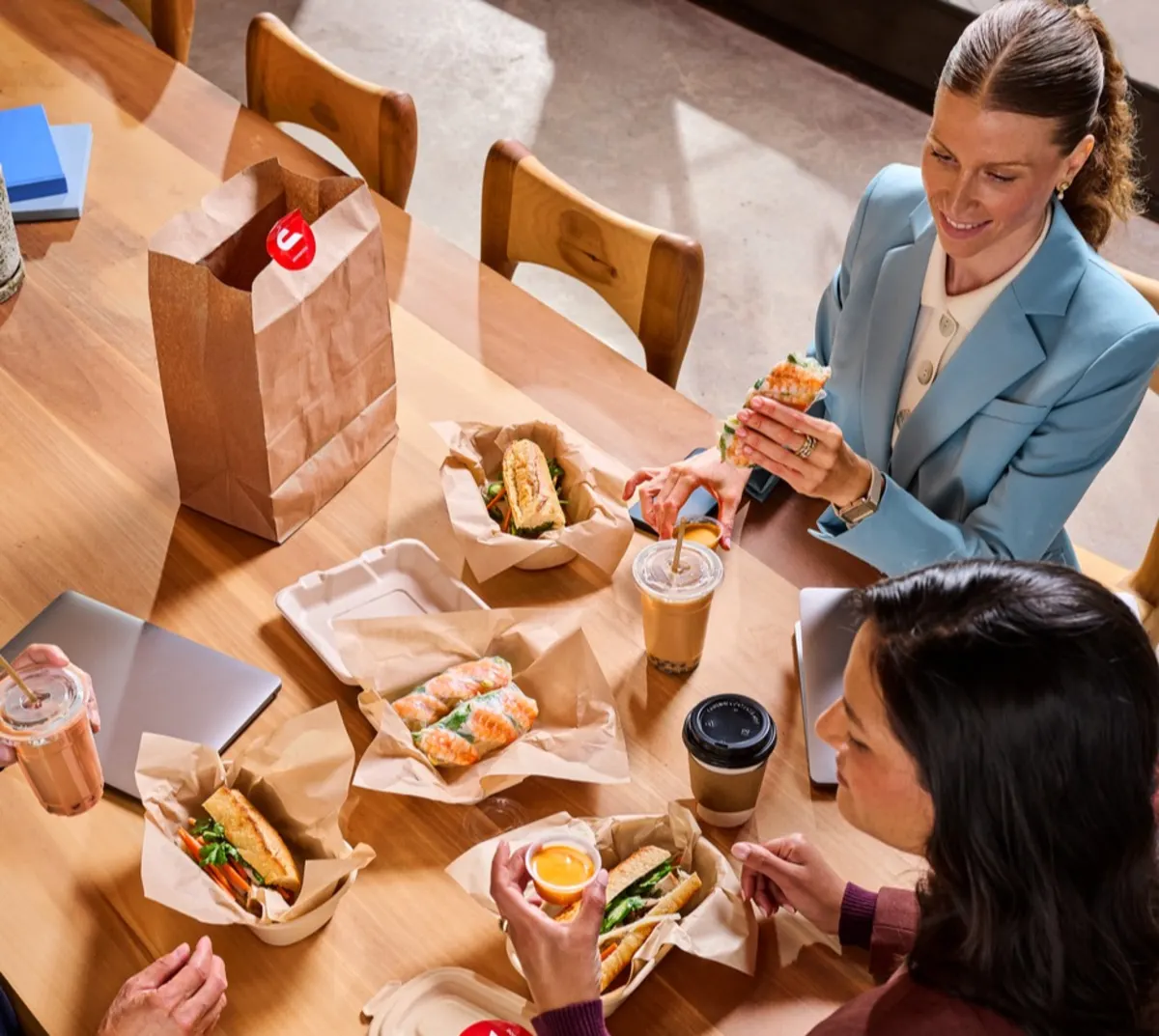 A group of people eating at their office