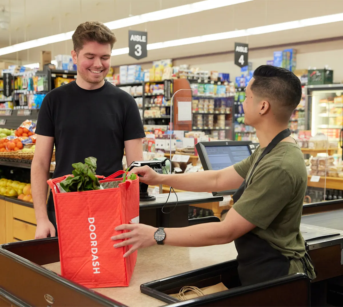 Dasher and employee at checkout