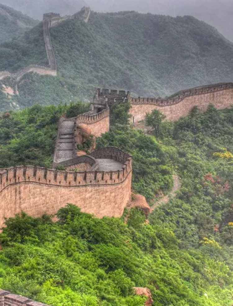 the Great Wall of China winding over mountainous terrain