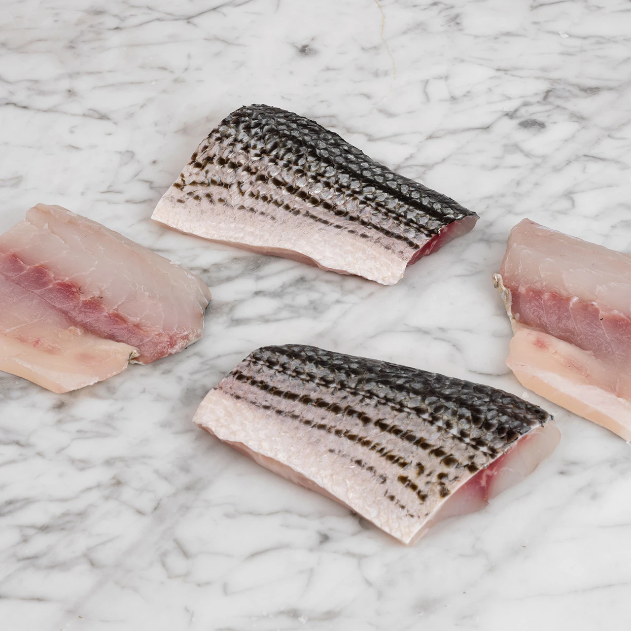 81891_WFMex_Raw_PORCIONES DE LOBINA RAYADA CON PIEL_Pescados