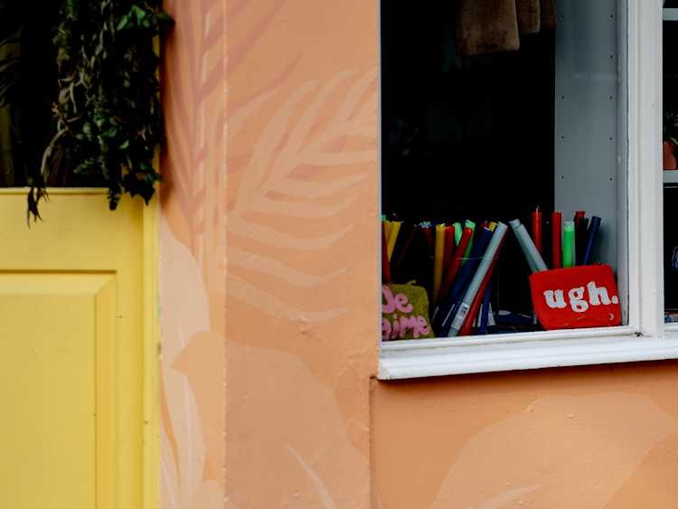 A bag that says "ugh" in a window to represent the feeling of a yeast infection from antibiotics.