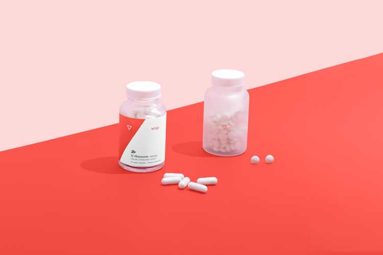 Bottles of d'mannose and probiotics for holistic UTI treatment